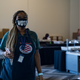 An election worker processes absentee ballots at State Farm Arena on November 2, 2020 in Atlanta, Ga.
